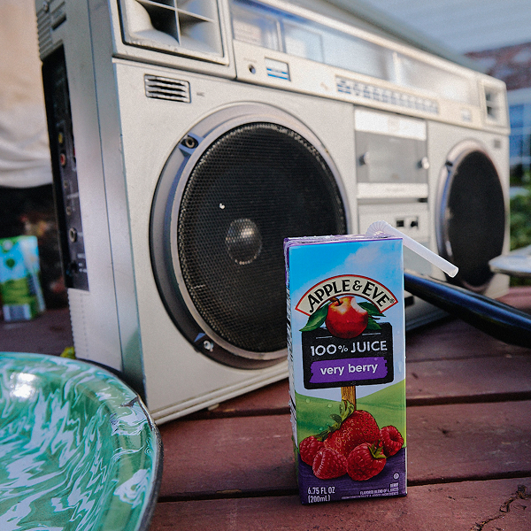 Very Berry Juice box next to a music boombox