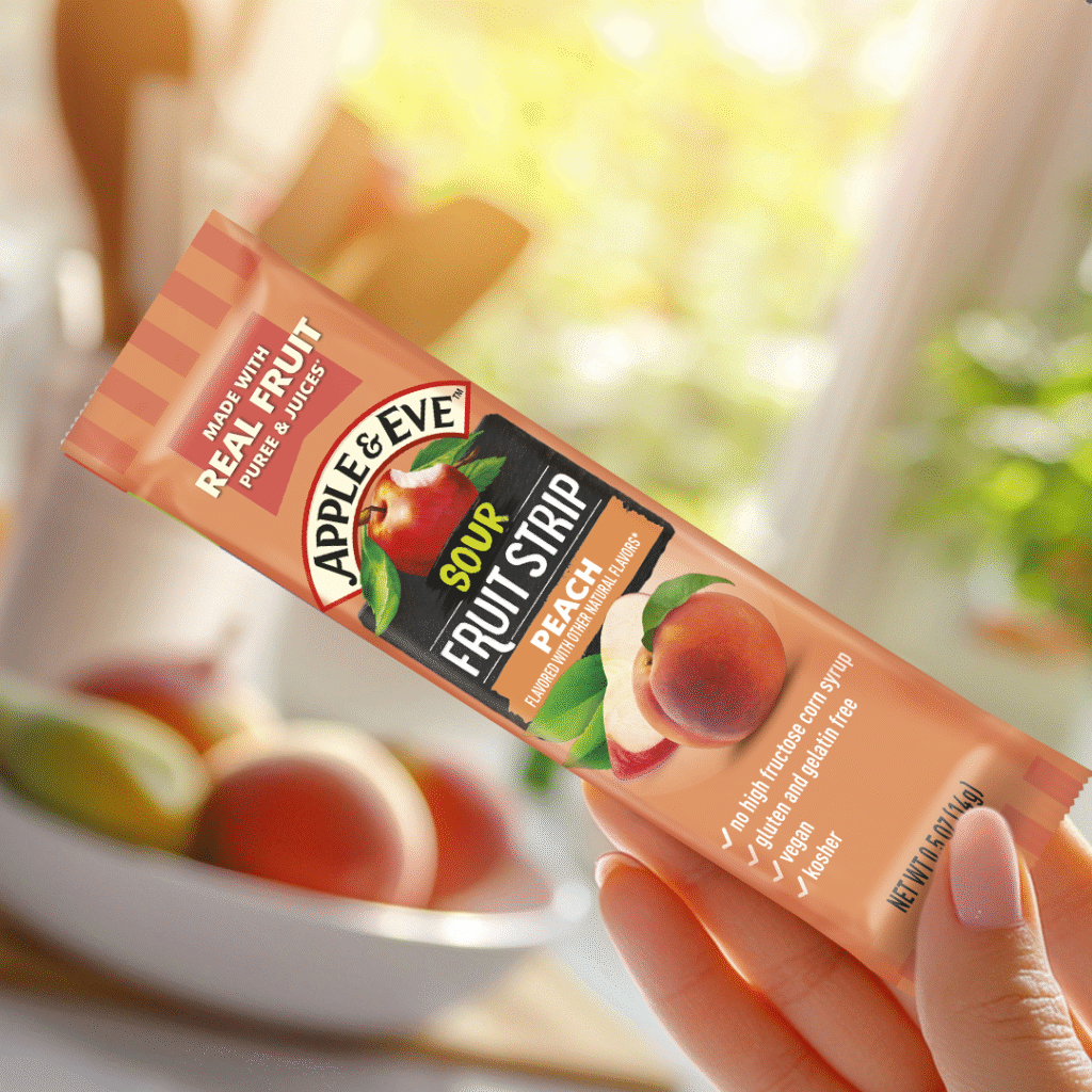 Sour Fruit Strip package held by womens hand.