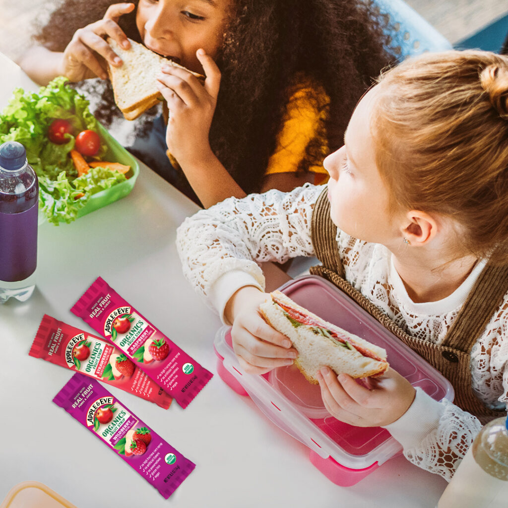 2 kids eating lunch including three juice strips